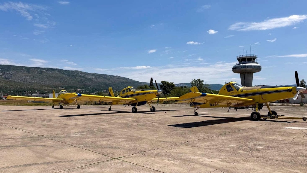 Three firefighting AT-802F aircraft sitting on a tarmac